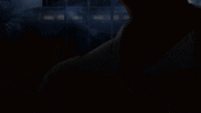 a silhouette of a man in a suit and tie is standing next to another man