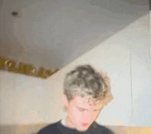 a blurry picture of a man with curly hair