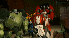 a group of transformers are standing next to each other and one has the letter m on his chest