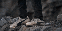 a person is climbing up a rocky hillside