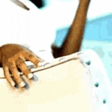 a close up of a person 's hand holding a briefcase .