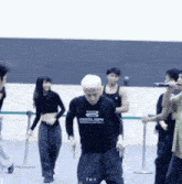 a man wearing a shirt that says tkv is dancing