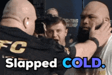 a man in a fc shirt is slapping another man in the face