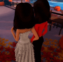 two dolls standing next to each other in a room