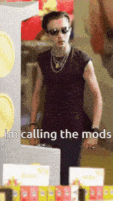 a man wearing sunglasses and a purple shirt says i 'm calling the mods on the bottom of the image