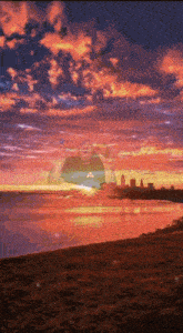 a man stands in front of a sunset with a city in the background