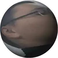 a close up of a man 's face in a circle
