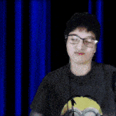 a boy with glasses and a speech bubble that says " ayiee "