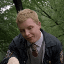 a man in a police uniform has a patch on his sleeve that says police department