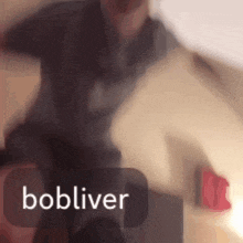 a blurry picture of a person with the name bobliver on the bottom right