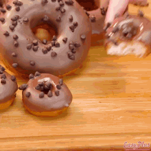 a close up of a donut with easy plus written on the bottom right