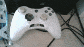 a white msi game controller sits on a table