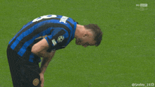 a man in a blue and black jersey with the number 22 on it
