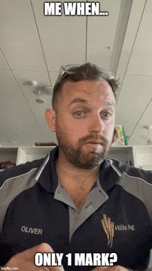 a man with a beard is wearing a shirt that says hills ag