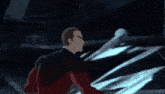 a man in a red jacket is fighting another man in a dark room with a sword .