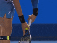 a tennis player is holding a tennis racquet in front of a scoreboard that says hills 7 6 5 6 6