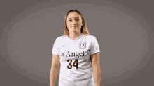 a woman wearing a los angeles jersey number 34