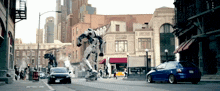a robot is riding a skateboard down a street with cars