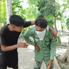 a man in a green shirt with the word army on the front