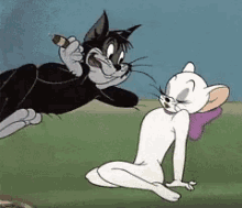 a black cat is holding a cigar while a white cat looks on