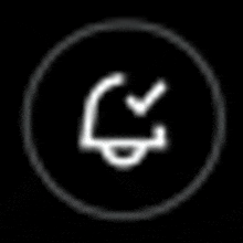 a white icon in a black circle with a check mark on it .