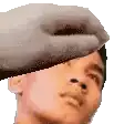 a close up of a person 's head with a hand on it .