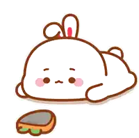a cartoon rabbit is laying on the ground next to a rock .