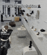 a man in a black bag is standing in a store with the caption pov life of a fashion