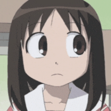 a close up of a cartoon girl 's face with brown hair