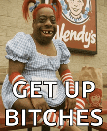 a wendy 's sign is behind a woman in a dress