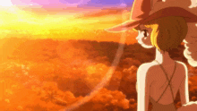 a girl in a hat stands in front of an orange sky