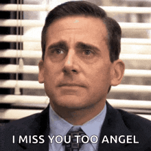 a man in a suit and tie is crying and saying i miss you too angel