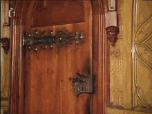 a wooden door with the letter g on the bottom