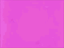 a close up of a cartoon character 's face with a pink background .