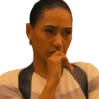 a woman covering her mouth with her hand and making a face