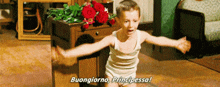 a young boy in underwear is standing in front of a table with roses and says buongiorno principessa .