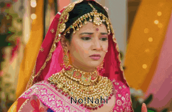 a bride in a pink and gold dress with the words no nahi written on the bottom