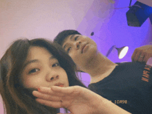 a man and a woman are posing for a picture with the date october 9