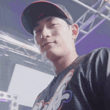 a man wearing a hat and a shirt that says ' sss ' on it