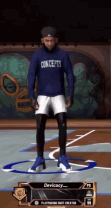a man wearing a concepts hoodie is standing on a court