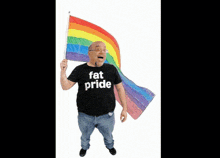 a man holding a rainbow flag and wearing a fat pride shirt