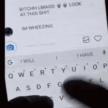 a person is typing on a cell phone with the words bitchh lmaoo at this shit on the screen