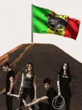 a group of people holding weapons in front of a flag that says community