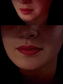 a close up of a woman 's face with red lipstick on