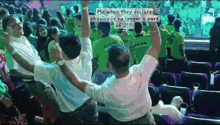 a crowd of people with their arms in the air and a caption that says me when they declare