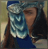 a woman wearing a helmet and a blue glove with feathers on it
