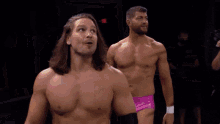 two wrestlers standing next to each other with the words i hope you can t wait