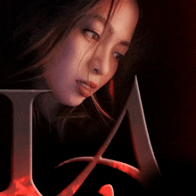 a close up of a woman 's face and the letter a
