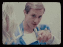 a blurry picture of a man and woman talking