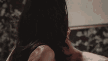 a close up of a woman kissing a man 's neck with ad written in the corner
